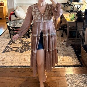 Embroidered button duster